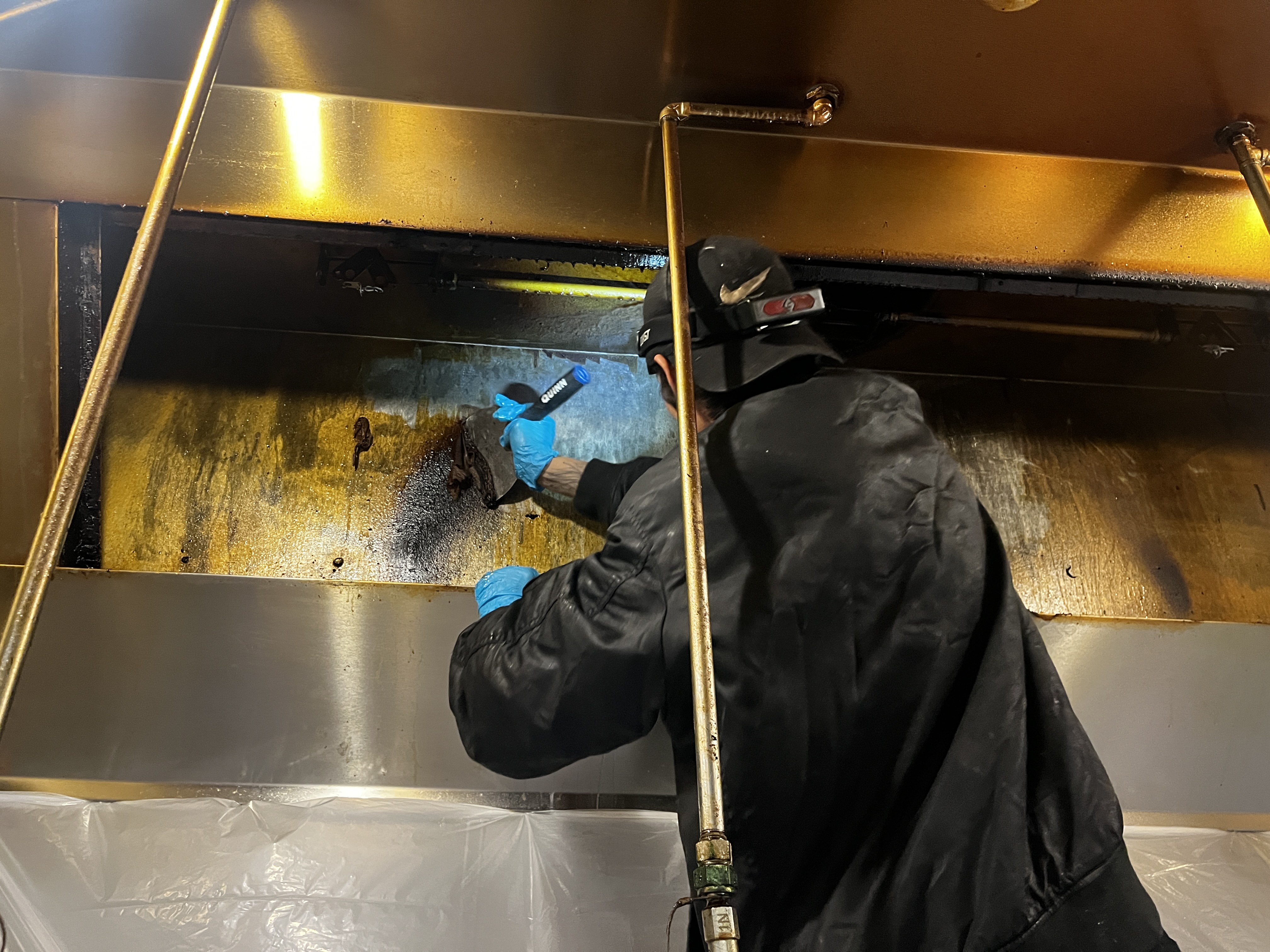 Hood system before cleaning - heavily soiled with grease